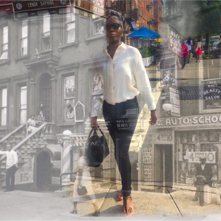 Harlem Strut A woman in a white blouse and sunglasses walks past a historic urban scene.